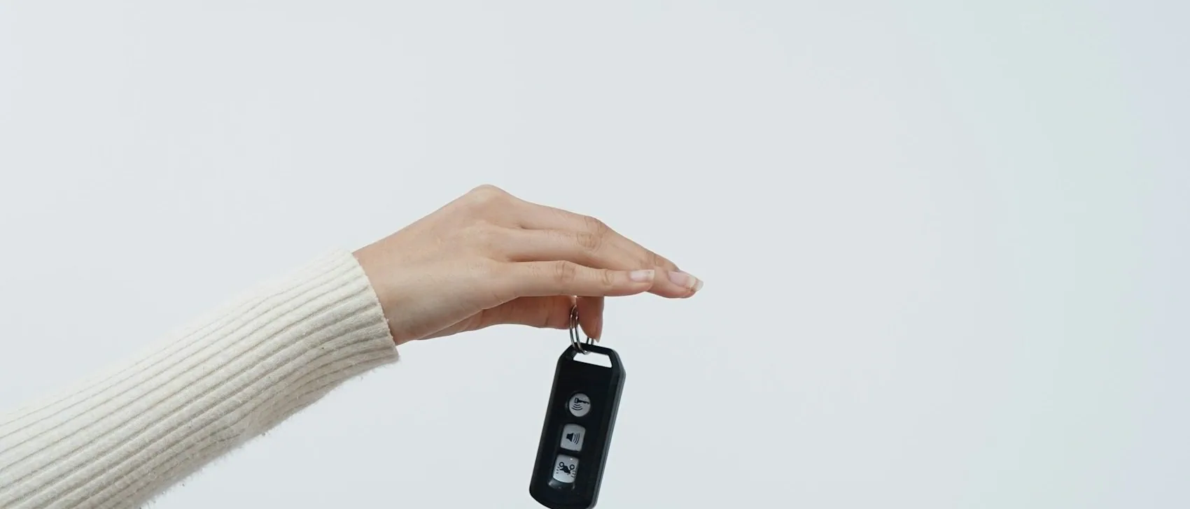 a car key being handed over