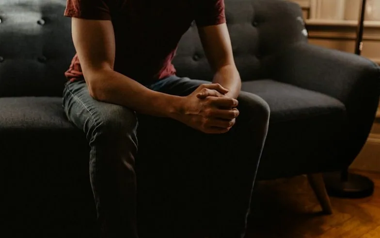 clasped hands, nervous — article card